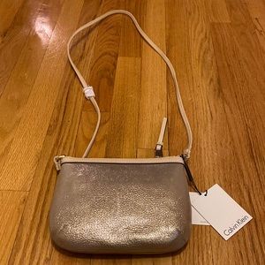 Calvin Klein leather purse . Never used . Tags still on. Brand new condition